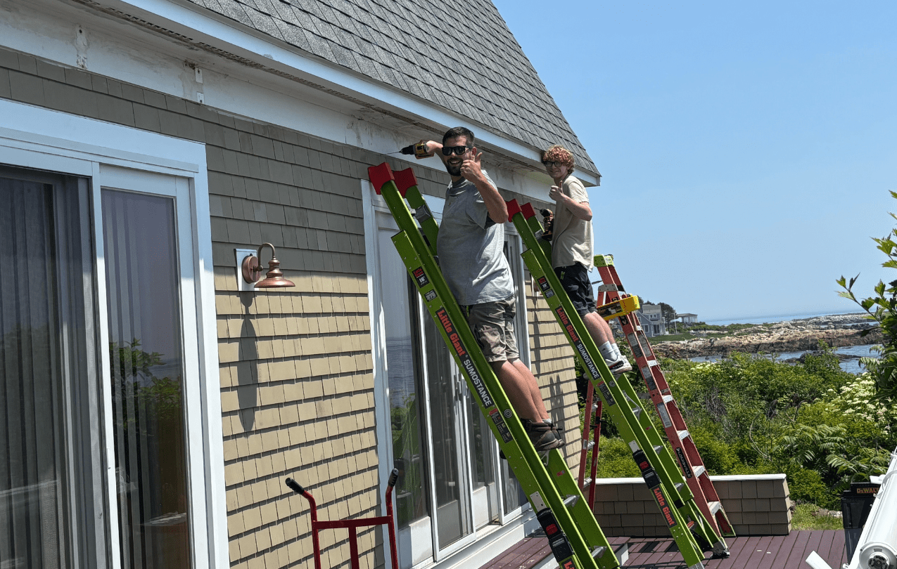 Yahd Space team installing an outdoor awning in southern maine